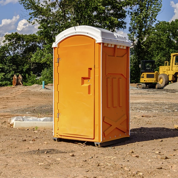 what is the cost difference between standard and deluxe portable toilet rentals in Keota